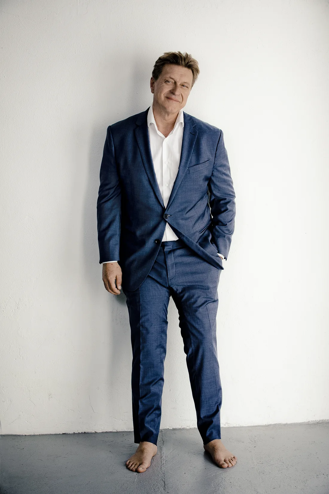 Andreas Maria Schwaiger in a navy suit