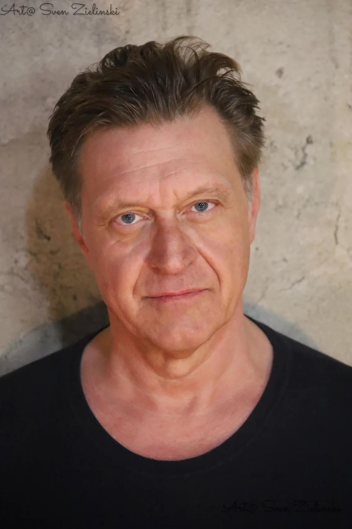 Andreas Maria Schwaiger, expressive headshot wearing a dark shirt